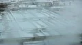 Vapour over water sewage treatment tanks with foam on surface HD Footage