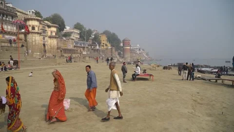 Varanasi, India - June 25th 2019: Walking along Varanasi Ghats by Ganges River Stock-Footage 310768024