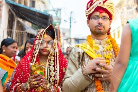 Varanasi, India, Mar 10, 2019 - Unknown sad wife and sad groom going to a Stock Photos