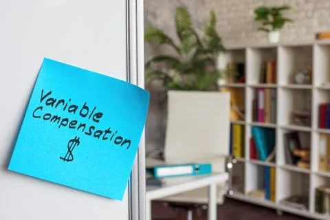 Variable compensation written on a sticker. Whiteboard in the office. Stock Photos