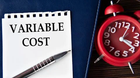 VARIABLE COST - words on a white sheet on the background of a notebook, ala.. 스톡 사진