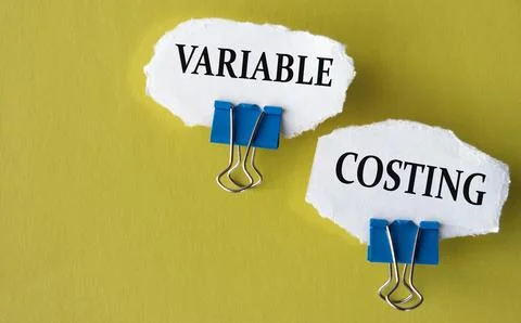 VARIABLE COSTING - the words is printed on a white piece of paper on a yellow Stock-Fotos