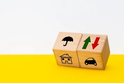 Variable insurance costs, increasing and decreasing, concept, wooden cubes Stock Photos