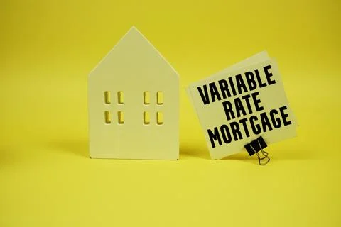 Variable Rate Mortgage text with house model on yellow background Stock-Fotos