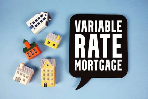 Variable Rate Mortgage text with house models on blue background Fotos de archivo