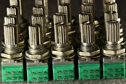 Variable resistances standing one behind the other in a column on the desktop Stock Photos