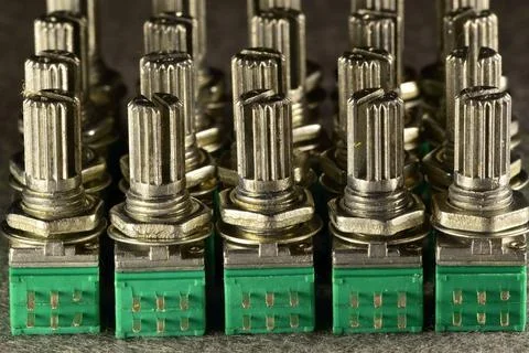 Variable resistances standing one behind the other in a column on the desktop Stock Photos