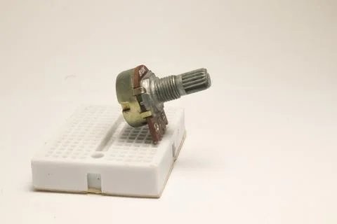 A variable resistor or potentiometer with code B10K stuck on a small project  Stock Photos