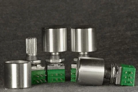 Variable resistors (potentiometers) with knobs for manual resistance adjustme 스톡 사진