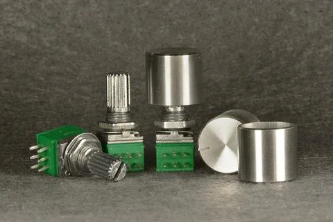 Variable resistors (potentiometers) with knobs for manual resistance adjustme 스톡 사진