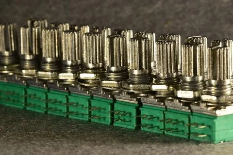 Variable single-turn carbon twin resistors in a row of twos on a desktop. Rea 스톡 사진