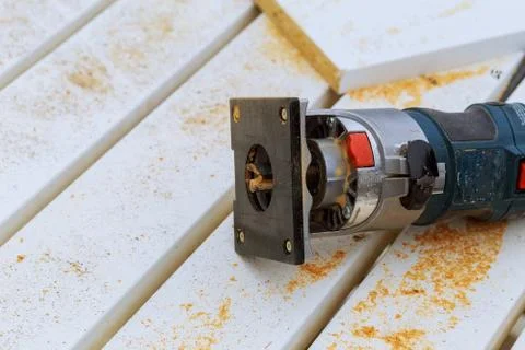 Variable speed plunge router isolated on sawdust background Stock-Fotos