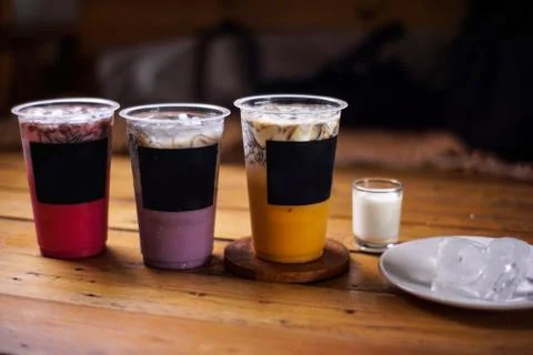 Variant of cold drinks with fruit flavor. fresh cafe menu with dark backgroun Stock Photos