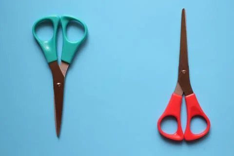 Variations of layouts of stationery items, scissors on a colored background Stock Photos