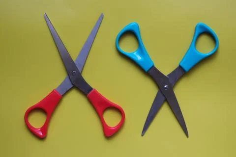 Variations of layouts of stationery items, scissors on a colored background Stock Photos