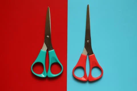 Variations of layouts of stationery items, scissors on a colored background Stock Photos