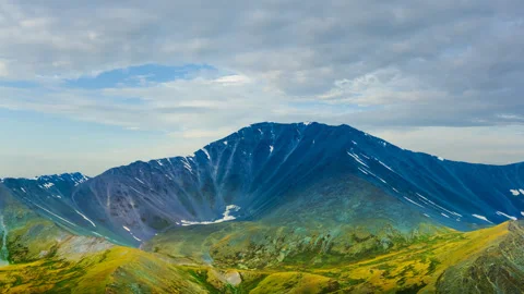 Varicoloured mount on the dramatic evening sky background time lapse scene Vídeos de archivo 288065128