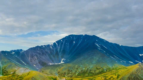 Varicoloured mount on the dramatic evening sky background Stock-Footage 332352258