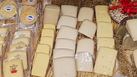 A varied selection of artisan cheeses, packaged snack Stock-Footage 344771571