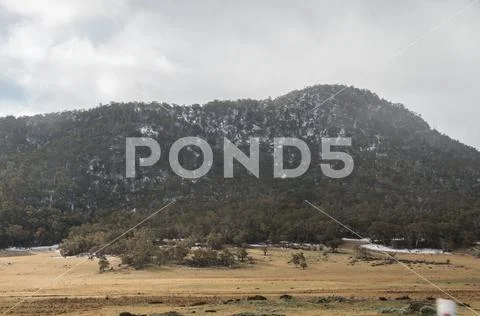 Varied snow conditions on hill Stock Photos