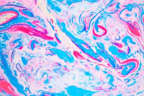 Variegated colored background, paint particles on white. Dye stains on the Stock Photos