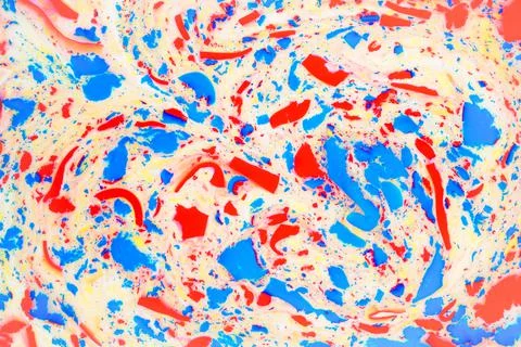 Variegated colored background, paint particles on white. Dye stains on the Stock Photos