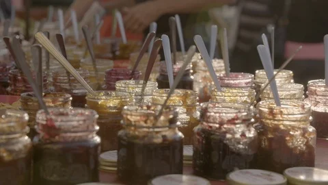 Varieties of jam kept for display on a table Stock Footage 87614278