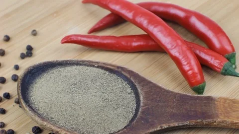 Varieties of Pepper Rotating on Wooden Plate Stock Footage 88409881