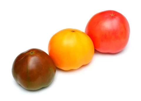 Varieties of tomatoes isolated on white background. Assorted tomato is yell.. Stock Photos