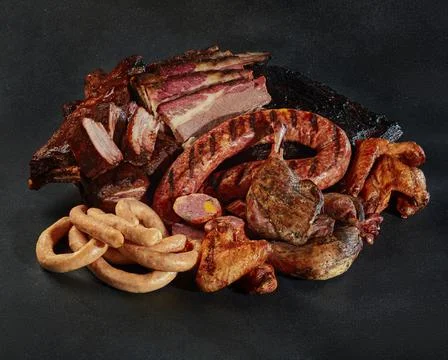 Variety of artisanal gourmet meat products and charcuterie Stock Photos