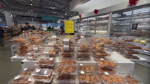 A Variety of Assorted Bakery Items Displayed Beautifully in a Modern Store Stockbeeldmateriaal 295075003