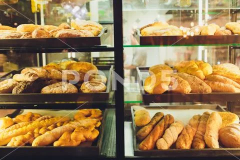 Variety of baked products at a supermarket. Stock Photos