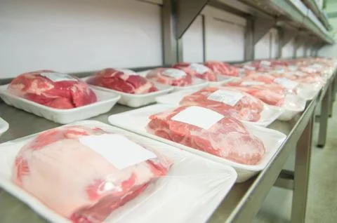 Variety of beef slices in boxes in supermarket Foto stock
