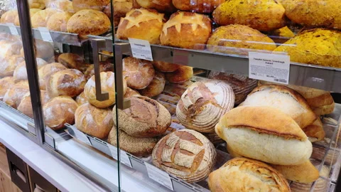 Variety of bread in the grocery store with bakery products neatly displayed on Stock-Footage 320144333