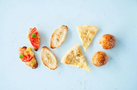 Variety bread snacks on a light background. Top view. Stock Photos