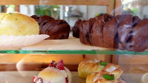 Variety of breads showing in display at bakery shop Stock Footage 247265039