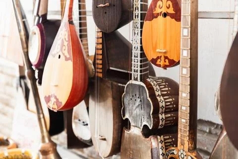 A variety of Central Asian stringed musical instruments are put up for sale Stock Photos