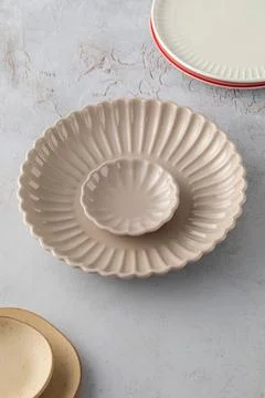 A variety of ceramic empty plates and bowls on the table. Kitchen, menu. 스톡 사진