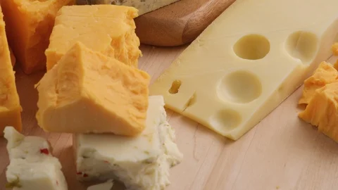 Variety of Cheeses; Cheddar, Blue Cheese, Swiss, Pepper Jack. Stock Footage
