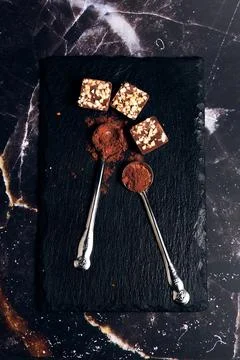 A variety of chocolates on a dark background 스톡 사진