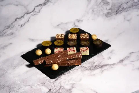 A variety of chocolates on a light background Stock-Fotos
