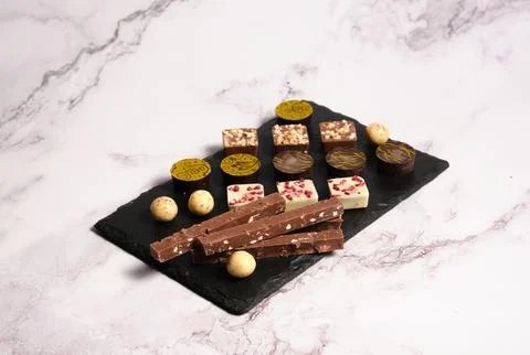A variety of chocolates on a light background 스톡 사진