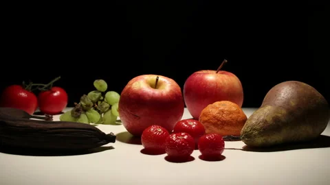 Variety of colorful fruit decomposing, timelapse, black background Stock Footage 239037733