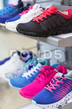 Variety of the colorful sneakers Stock Photos