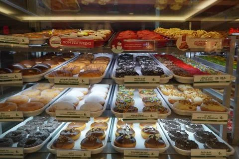 Variety of delicious donut in showcase on display at bakery cake shop Krispy  Stock-Fotos