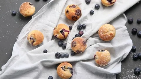 Variety of delicious muffins. Top view, rotation. Sweet desserts table Stock Footage 171925482