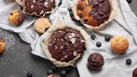 Variety of delicious muffins. Top view, rotation. Sweet desserts table Video stock 171925485