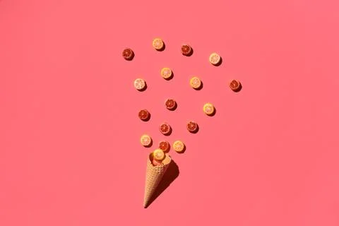 A variety of delicious sweets explode from the waffle cone, view from above Fotos Stock