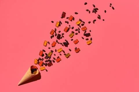 A variety of delicious sweets explode from the waffle cone, view from above Foto stock