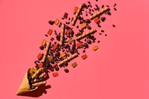 A variety of delicious sweets explode from the waffle cone, view from above Fotos Stock